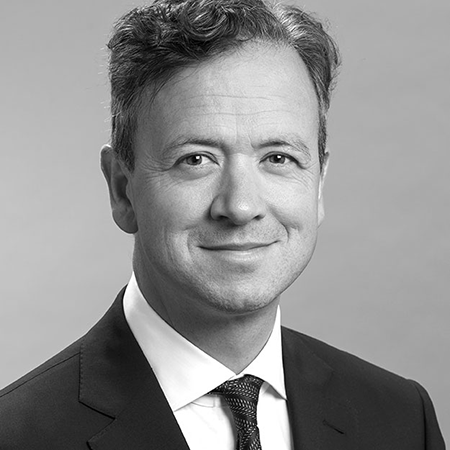 black and white portrait of founder Dr Paul Lynch